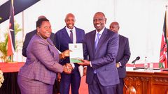 President William Ruto receiving a report from the Presidential Working Party on Education Reforms at State House on August 1, 2023