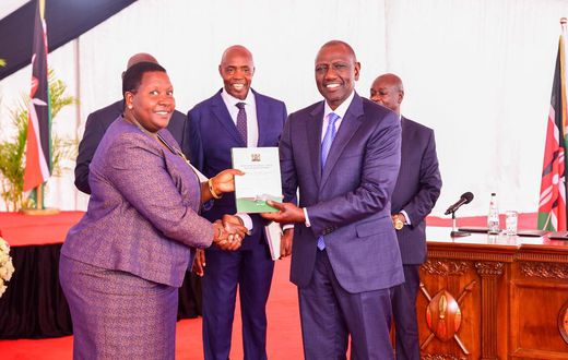 President William Ruto receiving a report from the Presidential Working Party on Education Reforms at State House on August 1, 2023