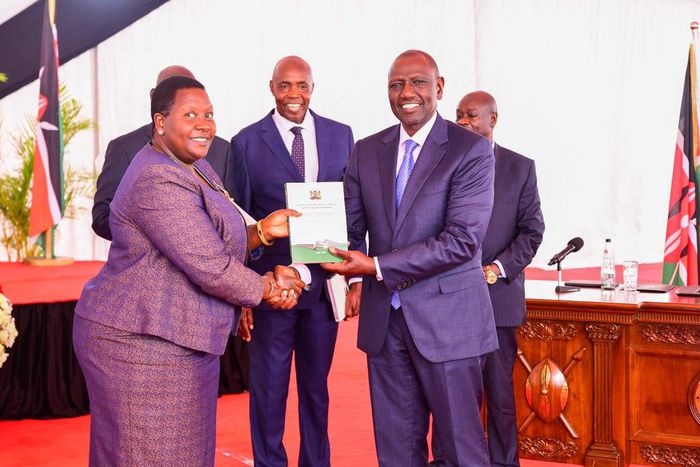 President William Ruto receiving a report from the Presidential Working Party on Education Reforms at State House on August 1, 2023