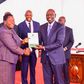 President William Ruto receiving a report from the Presidential Working Party on Education Reforms at State House on August 1, 2023