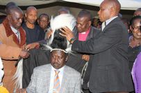 File image of Raila Odinga with Maina Njenga at a past event