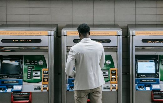 Man standing in front of a machine [Image Credit: Liliana Drew]