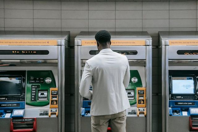 Man standing in front of a machine [Image Credit: Liliana Drew]