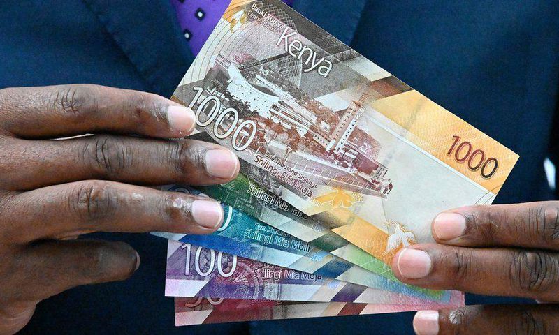 [FILE] Central Bank of Kenya (CBK) governor Patrick Njoroge displays some of the new designs for the Kenyan currency notes in 2019.