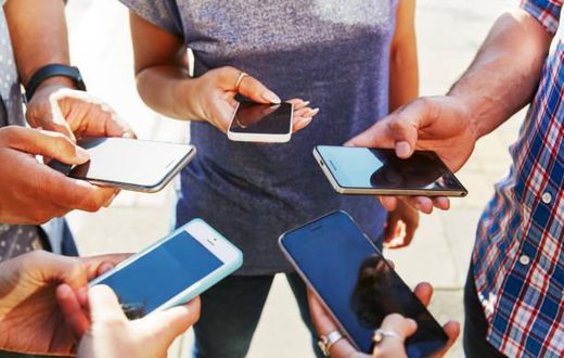 People using phones in public