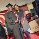 Ferdinand Omondi and his wife Njeri Omondi during his graduation in 2023