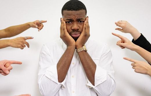 A man holding his face [Image credit: Yan Krukau]