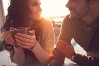 Couple drinking coffee and talking.