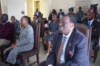 Smiling Mambo Mbotela during the swearing in ceremony