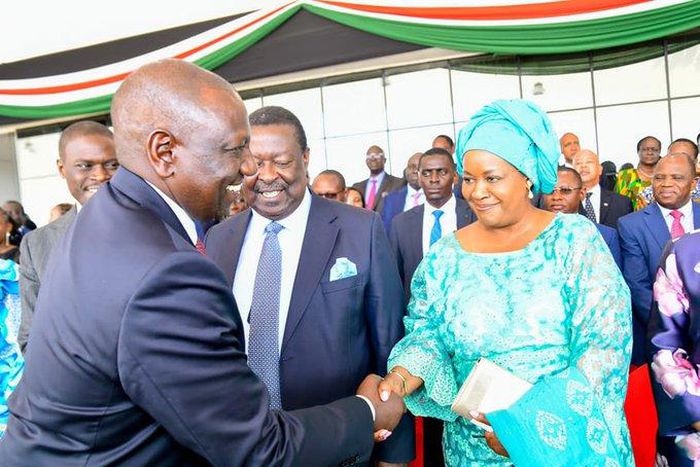 File image of President William Ruto greeting Musalia Mudavadi 's wife Tessie during the Mashujaa Day celebrations at Uhuru Gardens