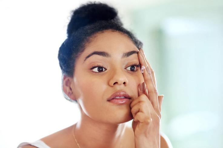 Lady fixing contact lens