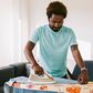 A photo of a man ironing clothes