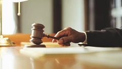 A photo of a judge striking gavel in a courtroom