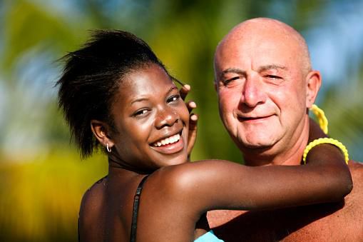 Old white man and young black girl -Getty Images/iStockphoto