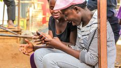 Kenyans using a phone