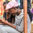 Kenyans using a phone