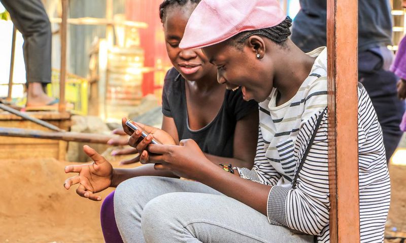 Kenyans using a phone