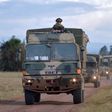 Military vehicles drive during a simulated military excercise of the British Army Training Unit in Kenya (BATUK) together with the Kenya Defence Forces (KDF) at the ol-Daiga ranch, high on Kenyas Laikipia plateau on March 26, 2018.  AFP PHOTO / TONY KA...
