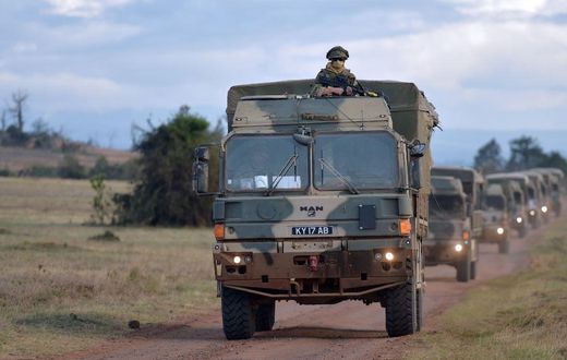 Military vehicles drive during a simulated military excercise of the British Army Training Unit in Kenya (BATUK) together with the Kenya Defence Forces (KDF) at the ol-Daiga ranch, high on Kenyas Laikipia plateau on March 26, 2018.  AFP PHOTO / TONY KA...