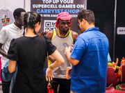 Bena Wa Malines interacting with gamers at Carry1st stand at Naiccon