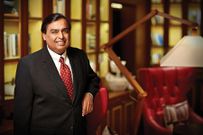 Billionaire Mukesh Ambani poses for a photo