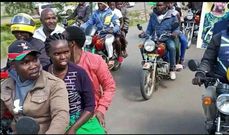 Gideon Cheruyiot, a boda boda rider, ferrying Linet Toto to a campaign rally