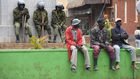 Ant-riot police and members of the public at a street in Kisii town
