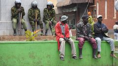 Ant-riot police and members of the public at a street in Kisii town