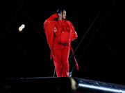 Her jumpsuit was strategically unzipped to reveal her growing baby bump.