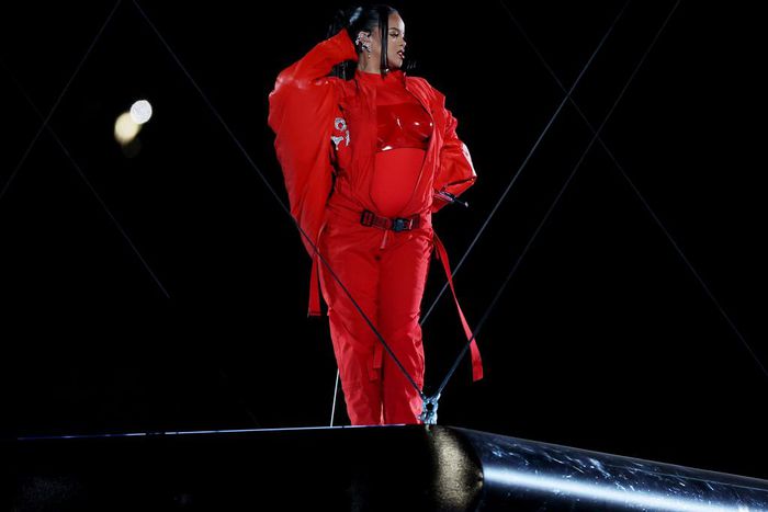 Her jumpsuit was strategically unzipped to reveal her growing baby bump.