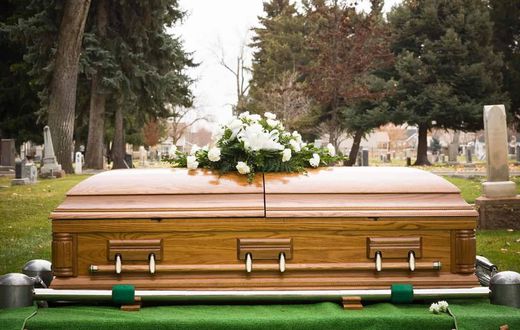 A casket during a burial