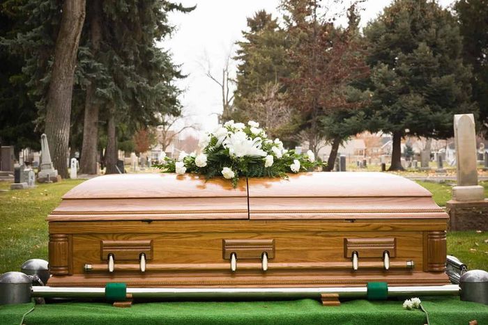 A casket during a burial