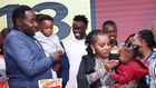 Willis Raburu, Ivy Namu and their children enjoying a cake