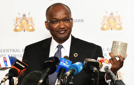 Central Bank of Kenya (CBK) Governor Patrick Njoroge displays a roll of shredded old generation Sh1,000 banknotes at a presss conference in Nairobi on October 2, 2019. (Photo by SIMON MAINA/AFP via Getty Images)