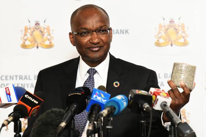 Central Bank of Kenya (CBK) Governor Patrick Njoroge displays a roll of shredded old generation Sh1,000 banknotes at a presss conference in Nairobi on October 2, 2019. (Photo by SIMON MAINA/AFP via Getty Images)