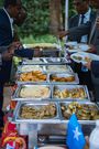 Participants serving different delicacies