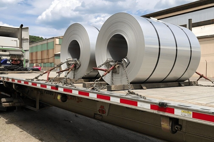 A trailer transporting steel coils