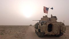US Army 3rd Division 3-7 Bradley fighting vehicles took up a position along a road on March 19, 2003, inside the demilitarized zone between Kuwait and Iraq.Scott Nelson