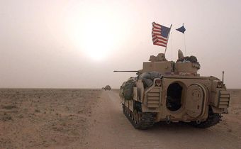 US Army 3rd Division 3-7 Bradley fighting vehicles took up a position along a road on March 19, 2003, inside the demilitarized zone between Kuwait and Iraq.Scott Nelson