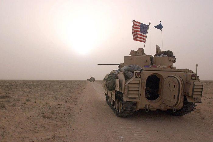 US Army 3rd Division 3-7 Bradley fighting vehicles took up a position along a road on March 19, 2003, inside the demilitarized zone between Kuwait and Iraq.Scott Nelson
