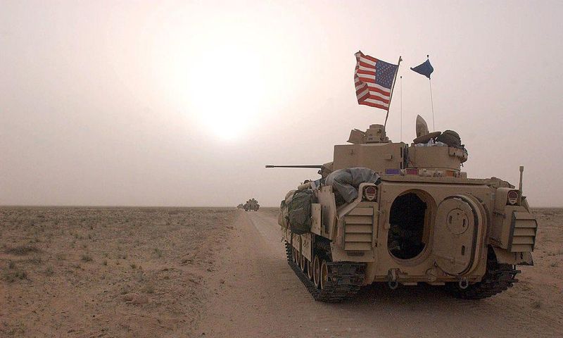 US Army 3rd Division 3-7 Bradley fighting vehicles took up a position along a road on March 19, 2003, inside the demilitarized zone between Kuwait and Iraq.Scott Nelson
