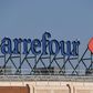 Carrefour has apologised for not closing a store in Brazil after an employee died, instead his body was covered with boxes and umbrellas and shopping continued