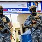 Officers from the Anti-terror Police Unit stand guard at the DCI National Forensic Lab