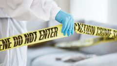 A stock image shows an investigator at a crime sceneJacob Wackerhausen/Getty Images