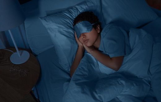 A person asleep in bed [Photo: Ground Picture]