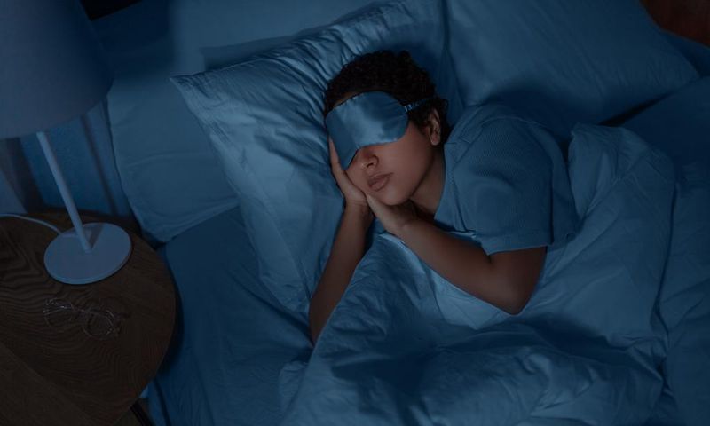 A person asleep in bed [Photo: Ground Picture]