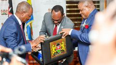 Treasury CS Njuguna Ndung'u with PS Chris Kiptoo having a look at Kenya's budget briefcase