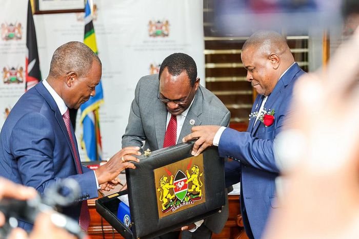 Treasury CS Njuguna Ndung'u with PS Chris Kiptoo having a look at Kenya's budget briefcase