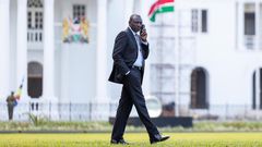 President William Ruto taking a phone call at State House, Nairobi