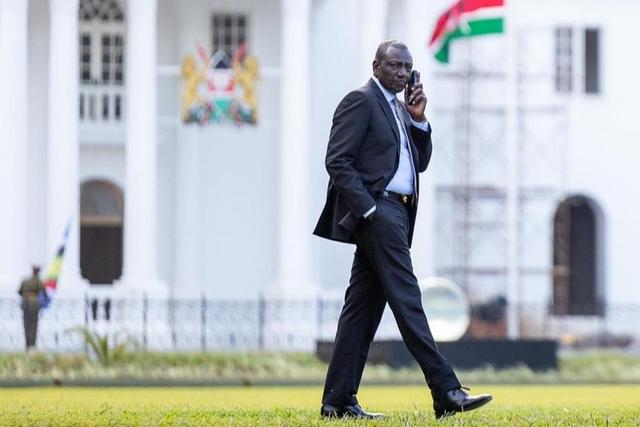 President William Ruto taking a phone call at State House, Nairobi